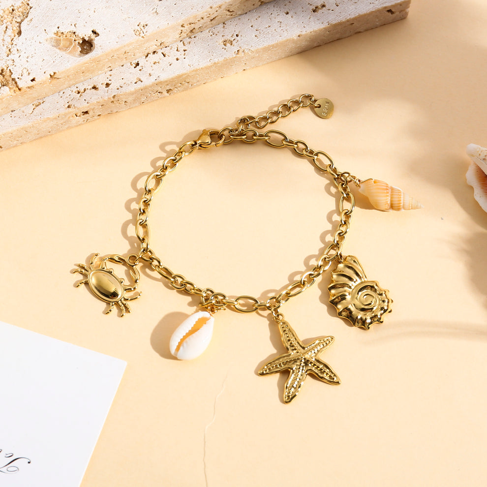 Bracelet doré à charms coquillage étoile de mer