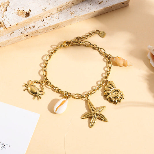 Bracelet doré à charms coquillage étoile de mer
