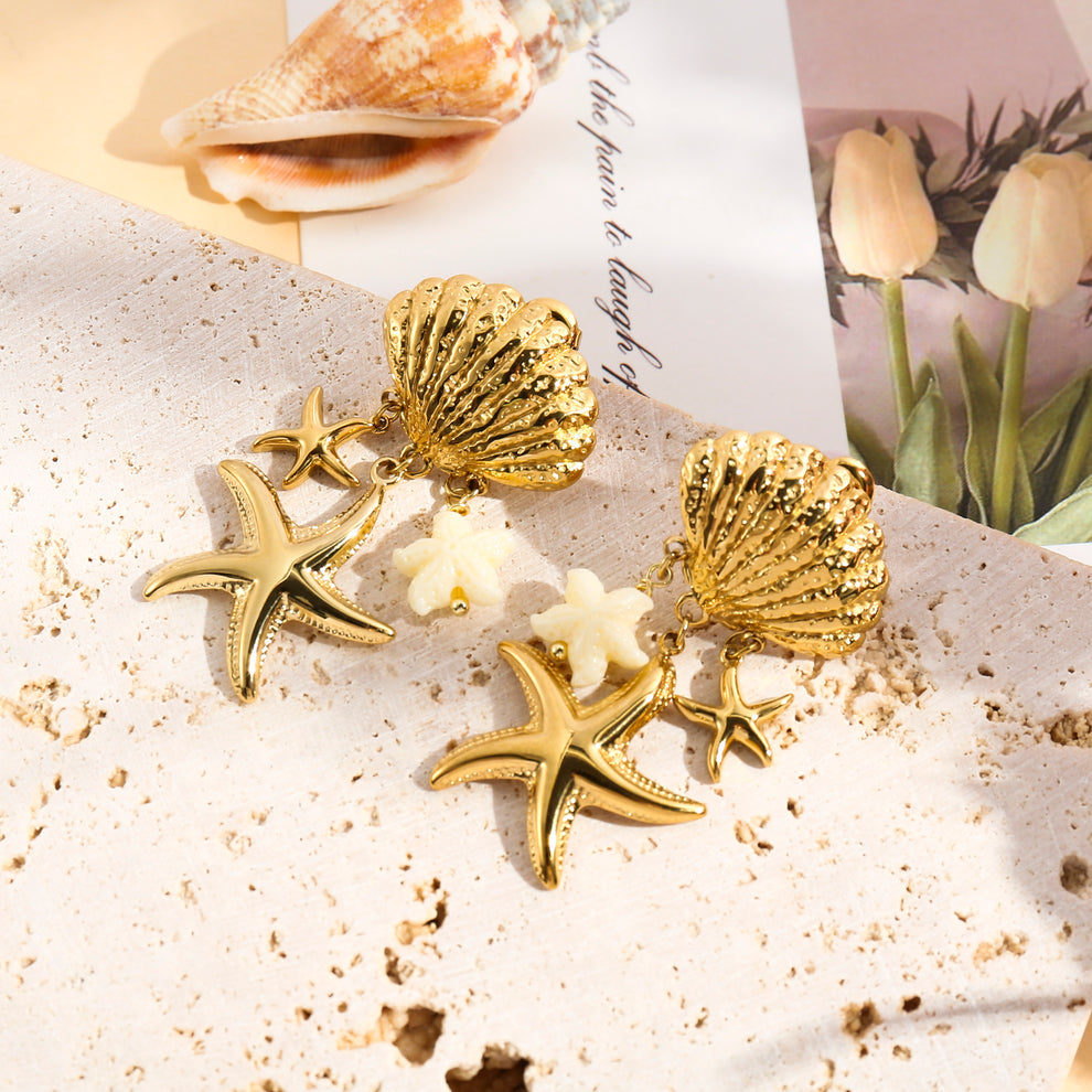 Boucles d'oreille dorée créole étoile de mer strass