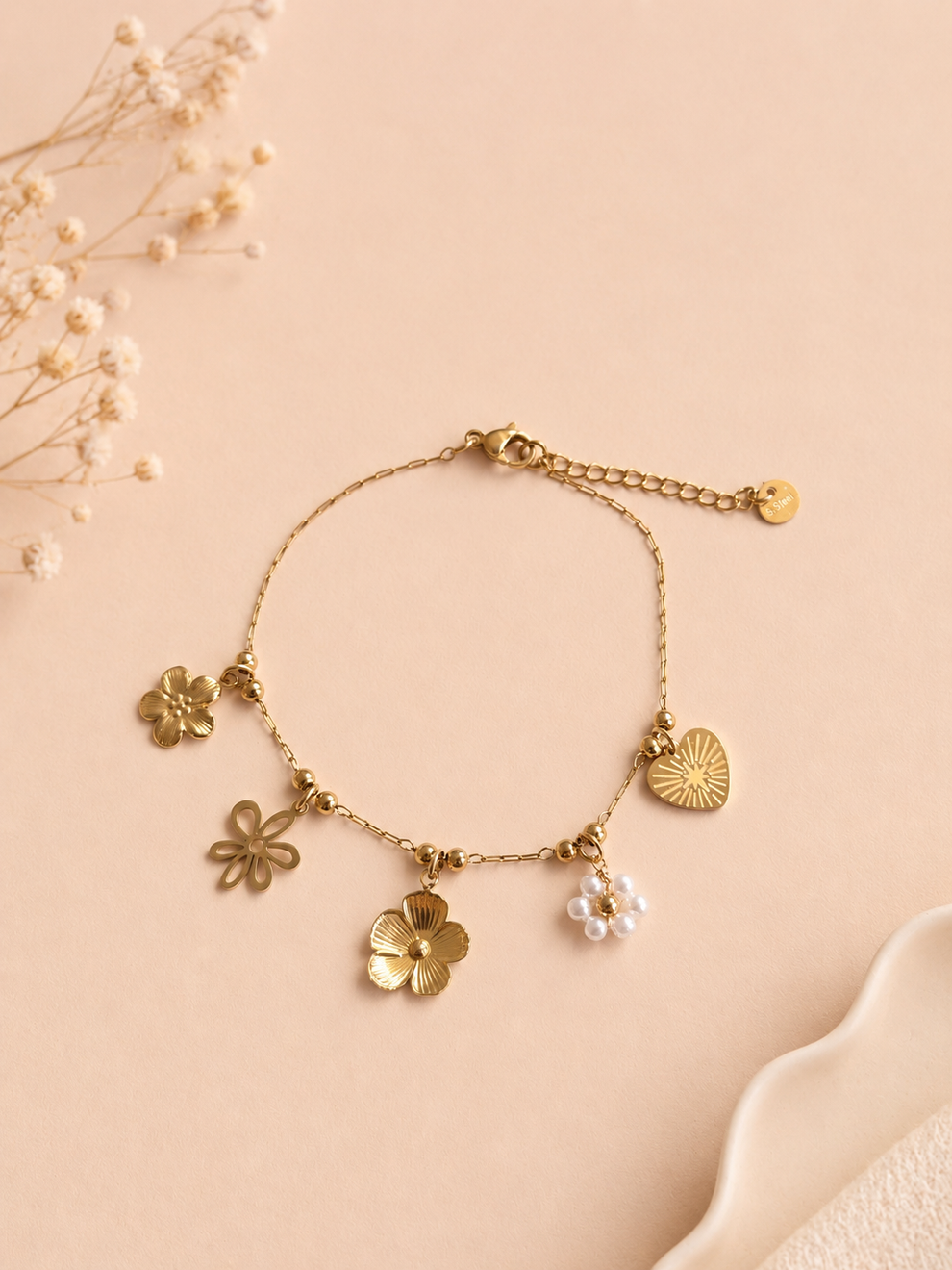 Bracelet doré à charms